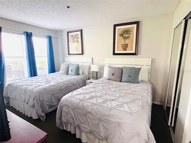 6337 Parc Corniche Dr Unit 2101, Orlando, FL 32821 - bedroom with a textured ceiling