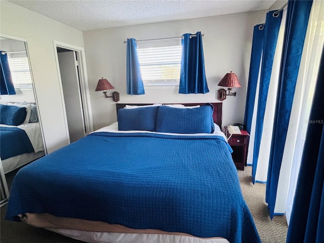 6337 Parc Corniche Dr Unit 2101, Orlando, FL 32821 - carpeted bedroom with a textured ceiling