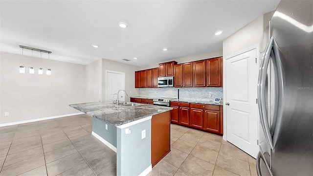 11201 Hudson Hills Ln, Riverview, FL 33579 - kitchen featuring stainless steel appliances, a sink, light tile patterned floors, backsplash, and light stone counters