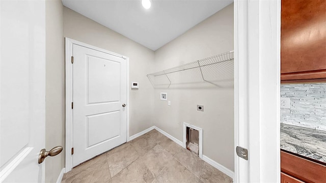 11201 Hudson Hills Ln, Riverview, FL 33579 - clothes washing area with hookup for a washing machine, hookup for an electric dryer, and baseboards