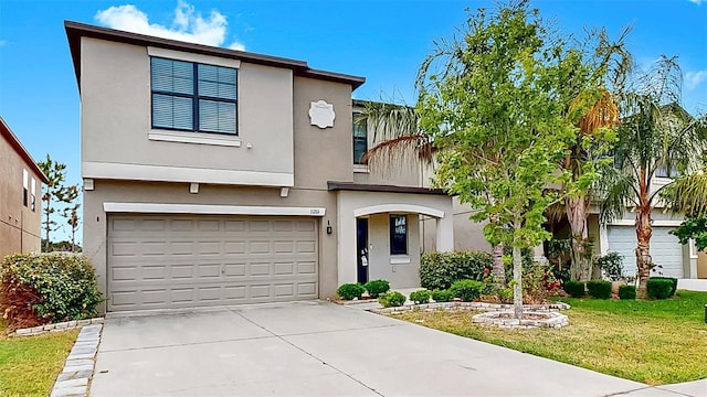 11201 Hudson Hills Ln, Riverview, FL 33579 - view of front of property featuring a garage, concrete driveway, stucco siding, and a front yard