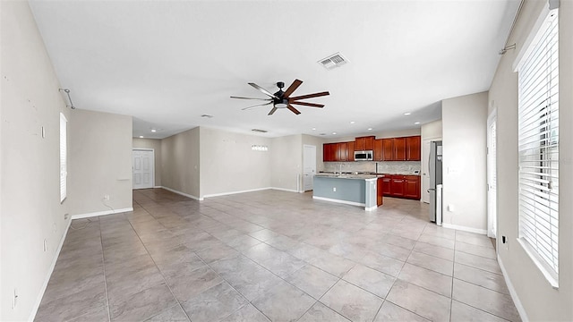 11201 Hudson Hills Ln, Riverview, FL 33579 - unfurnished living room featuring a ceiling fan, baseboards, recessed lighting, and light tile patterned floors