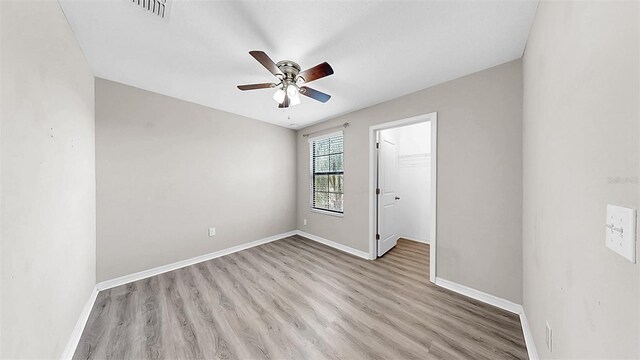 11201 Hudson Hills Ln, Riverview, FL 33579 - spare room featuring a ceiling fan, wood finished floors, and baseboards
