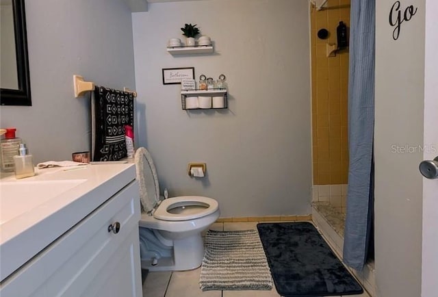 bathroom with vanity, a shower with curtain, toilet, and tile patterned floors