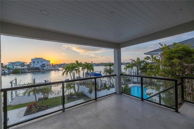 8505 Blind Pass Dr, Treasure Island, FL 33706 - balcony with a water view and view of pool area