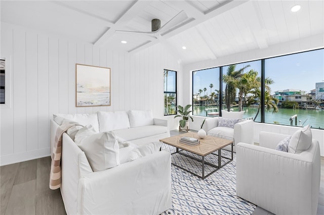 8505 Blind Pass Dr, Treasure Island, FL 33706 - living area with wood finished floors, a water view, a ceiling fan, recessed lighting, and baseboards