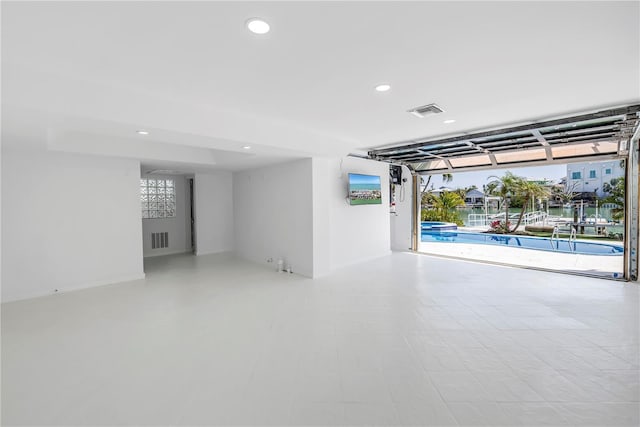 8505 Blind Pass Dr, Treasure Island, FL 33706 - garage featuring recessed lighting