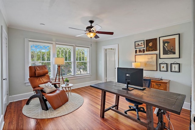 office area with ornamental molding, wood finished floors, a ceiling fan, and baseboards