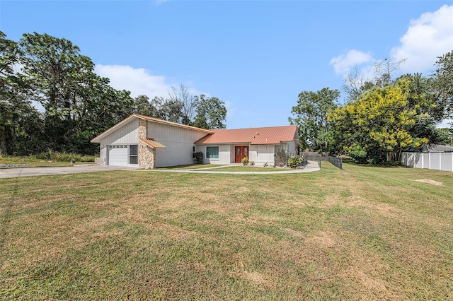 ranch-style house with a garage and a front lawn