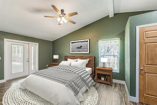 bedroom with ceiling fan, access to outside, and vaulted ceiling with beams