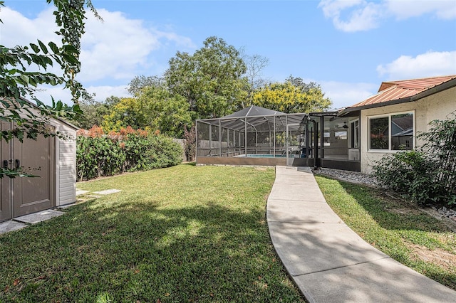 view of yard featuring glass enclosure and a storage shed