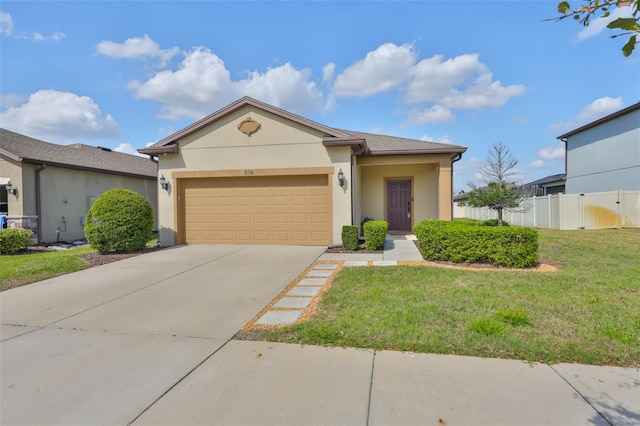 view of front of property featuring a front lawn and a garage