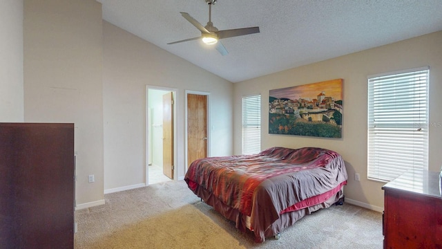 bedroom with lofted ceiling, a ceiling fan, light carpet, a textured ceiling, and baseboards