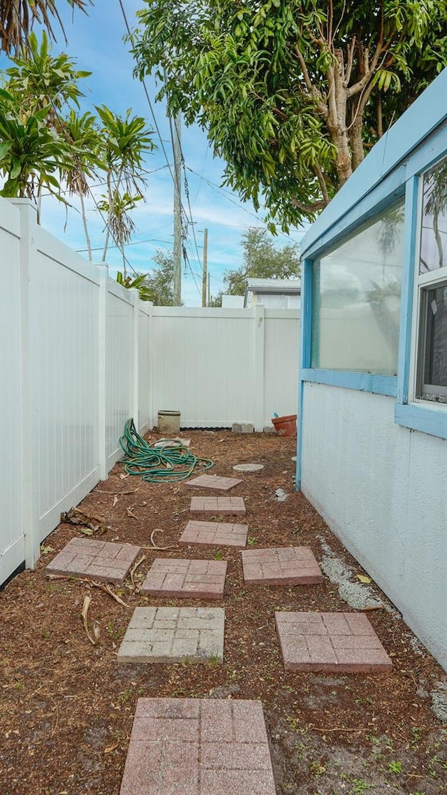 view of yard with an outbuilding and a fenced backyard