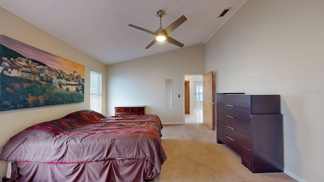 bedroom featuring baseboards, visible vents, light colored carpet, lofted ceiling, and a textured ceiling