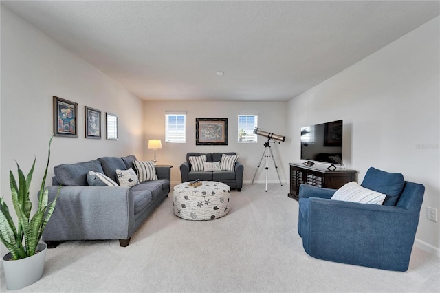 living room featuring carpet floors and baseboards