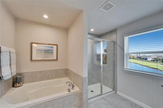 full bath featuring baseboards, visible vents, tile patterned floors, a shower stall, and a bath