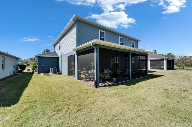 back of property featuring a sunroom, cooling unit, and a lawn