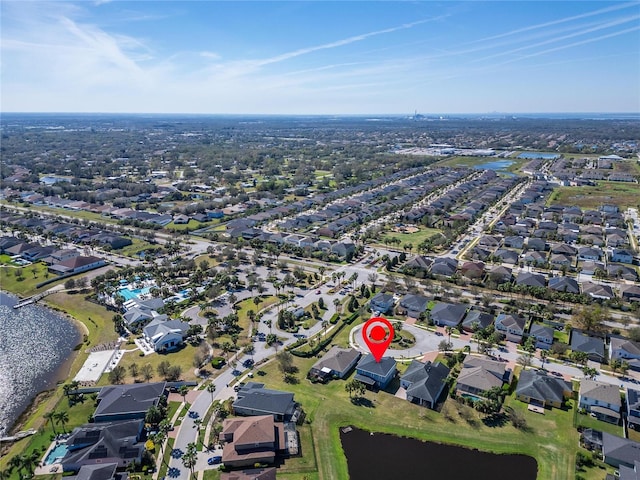 aerial view featuring a residential view and a water view