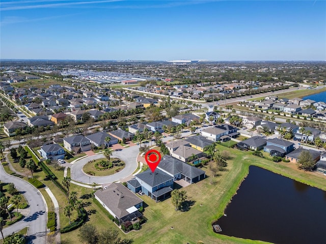 birds eye view of property featuring a residential view and a water view