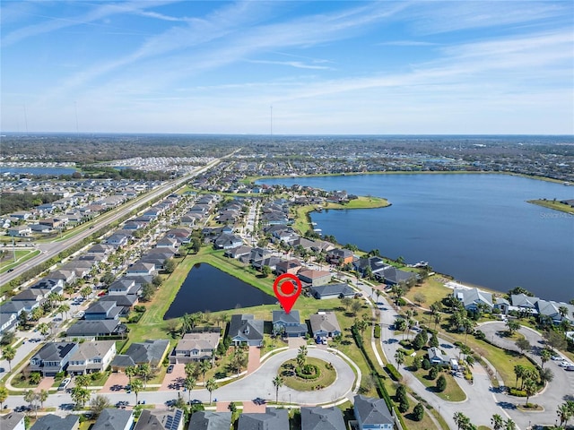 aerial view with a residential view and a water view