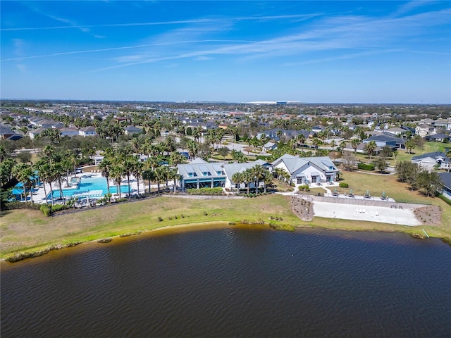 drone / aerial view featuring a residential view and a water view