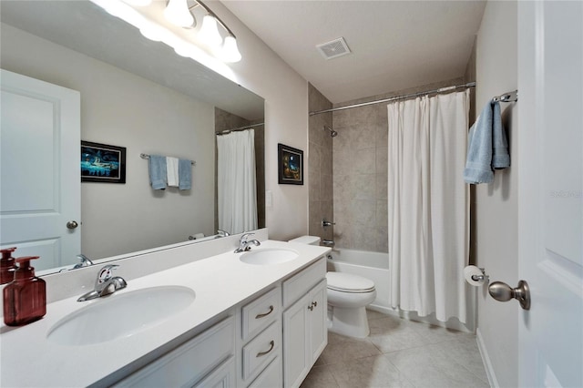 full bath with tile patterned flooring, visible vents, a sink, and double vanity