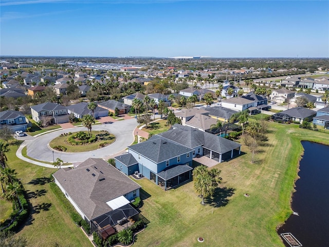 birds eye view of property with a residential view and a water view