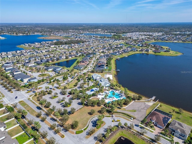 birds eye view of property featuring a residential view and a water view