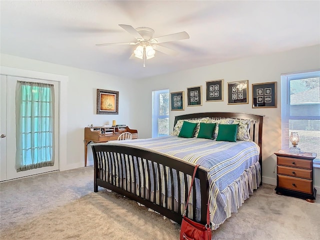 bedroom featuring baseboards, a ceiling fan, and carpet flooring