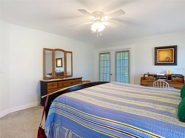 bedroom featuring carpet flooring, a ceiling fan, and baseboards