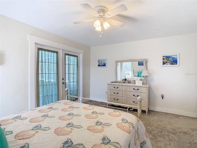 carpeted bedroom featuring access to outside, ceiling fan, and baseboards