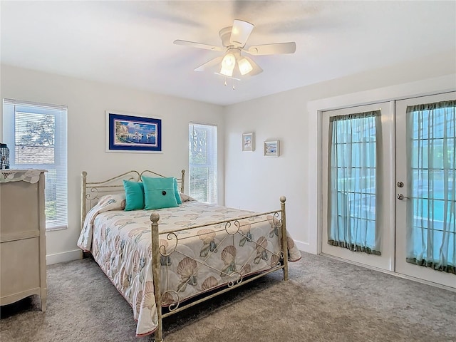 bedroom featuring multiple windows, carpet flooring, and french doors