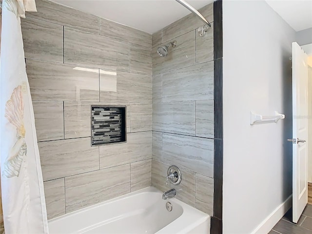 full bath with baseboards and shower / tub combo with curtain