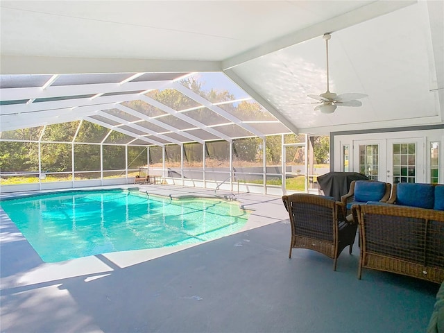 outdoor pool with a patio, an outdoor hangout area, area for grilling, a ceiling fan, and french doors