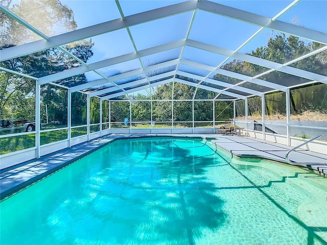 outdoor pool featuring a patio and a lanai