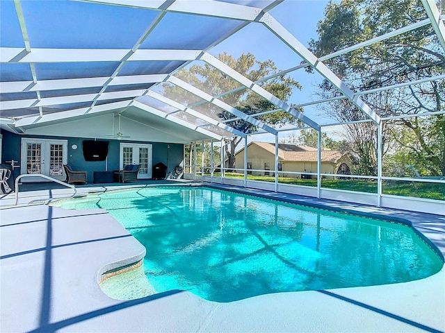 pool with french doors, glass enclosure, a patio, and ceiling fan