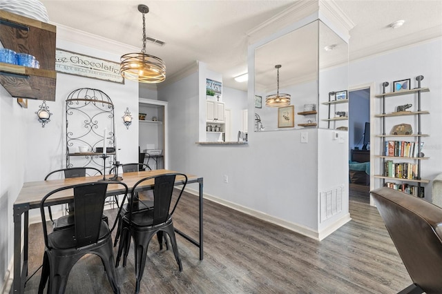 dining space with visible vents, baseboards, dark wood-style floors, and ornamental molding