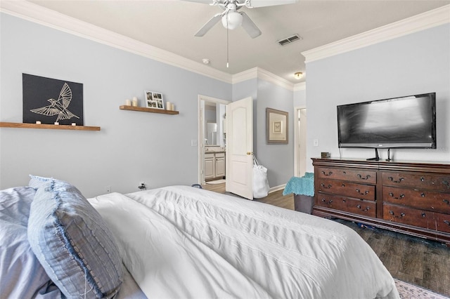 bedroom featuring visible vents, wood finished floors, crown molding, baseboards, and ceiling fan