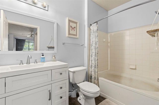 full bath featuring wood finished floors, toilet, vanity, and shower / bathtub combination with curtain