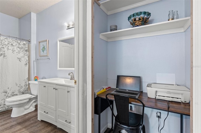 office space with dark wood finished floors and a sink