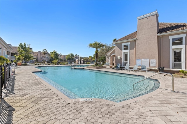 pool featuring a patio area