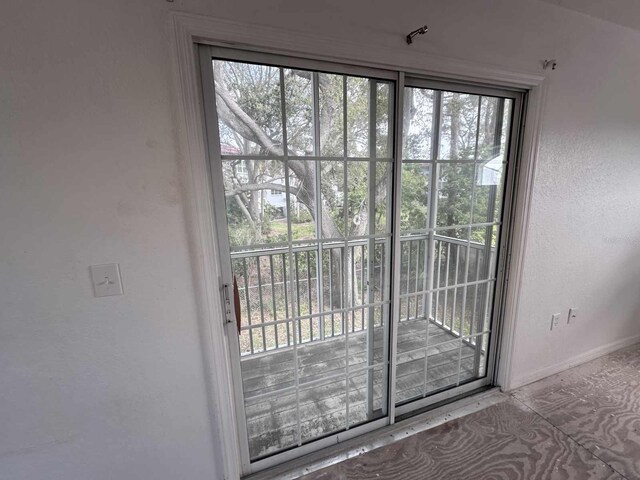 entryway with plenty of natural light and baseboards