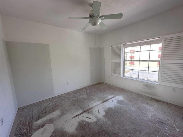 spare room with ceiling fan