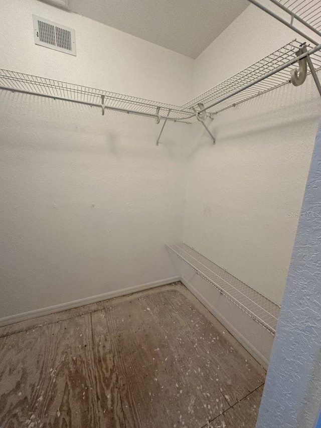 walk in closet with visible vents