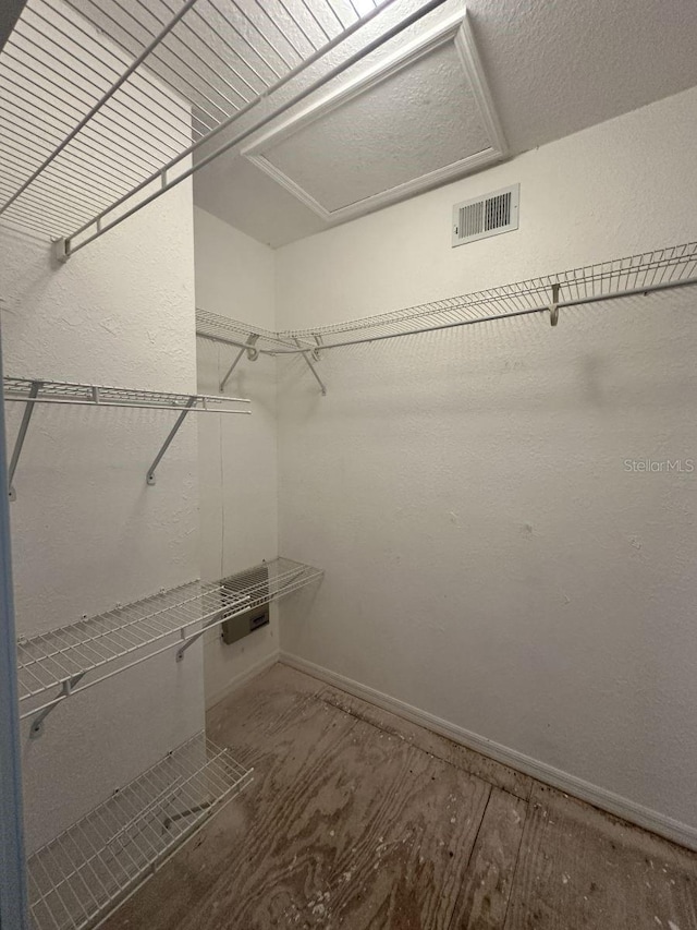 walk in closet with visible vents