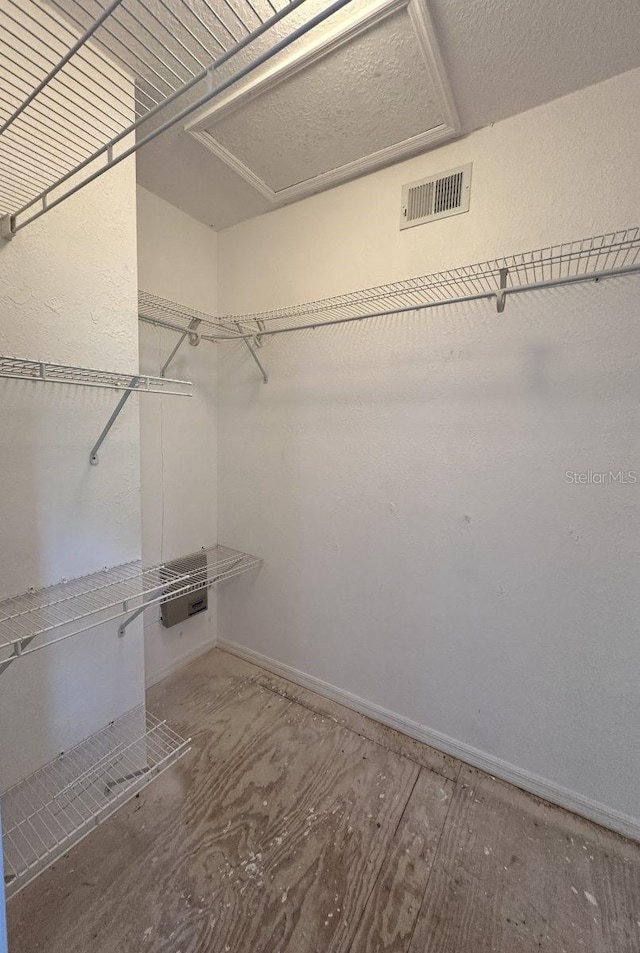 walk in closet with visible vents