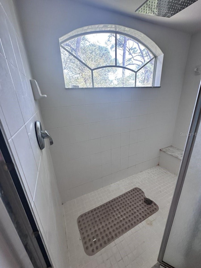 full bathroom with tiled shower