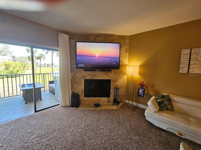 530 Sandy Hook Rd, Treasure Island, FL 33706 - living room with a textured ceiling, carpet flooring, a fireplace, and a textured wall