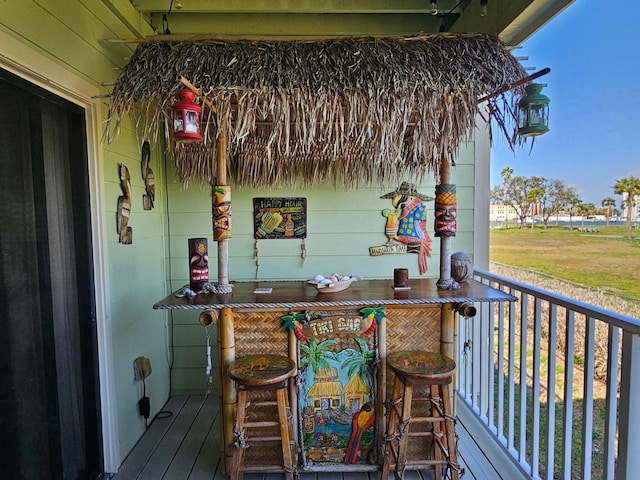 530 Sandy Hook Rd, Treasure Island, FL 33706 - wooden terrace featuring covered porch